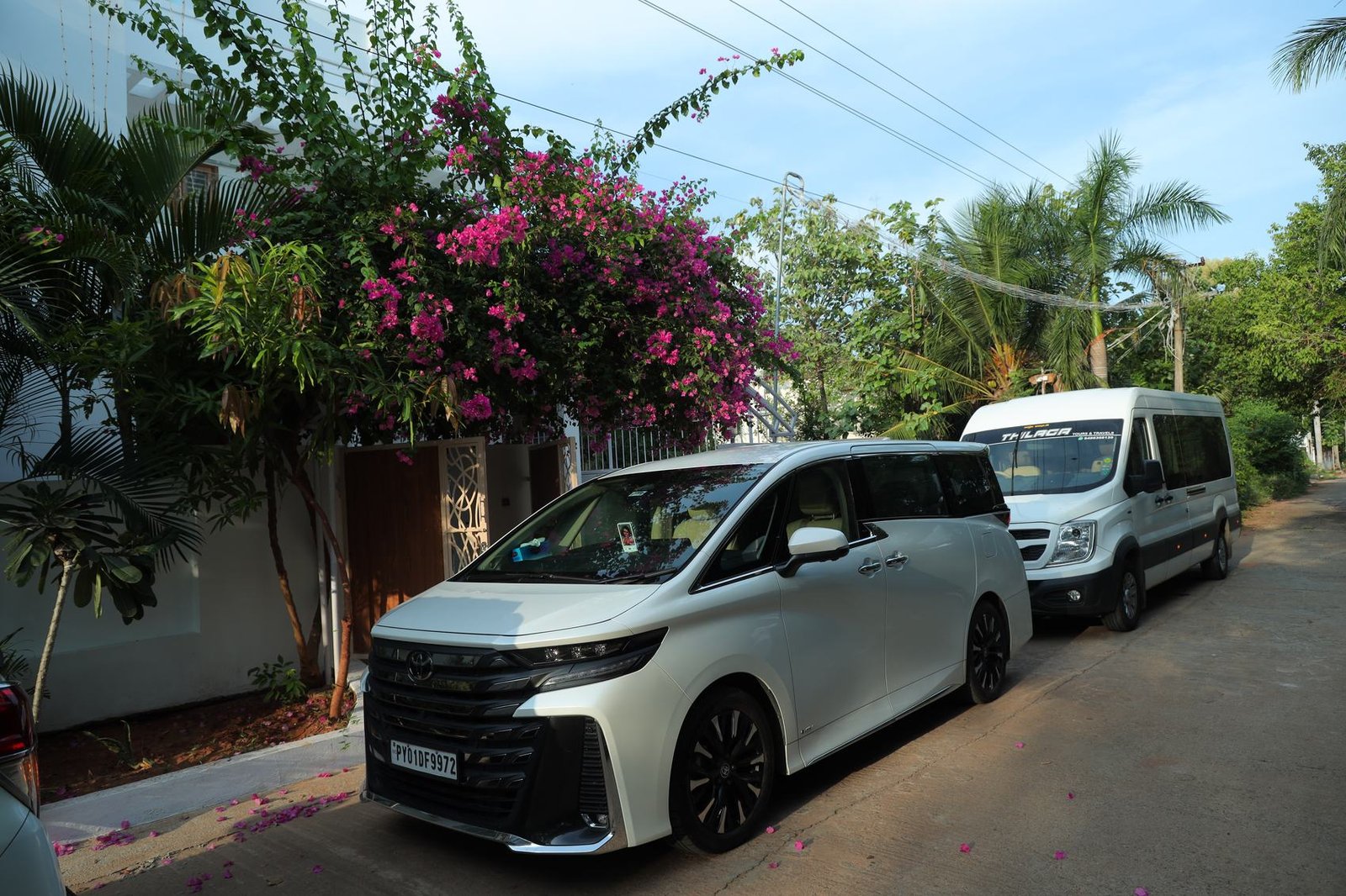 Vellfire and tempo traveller on the lane
